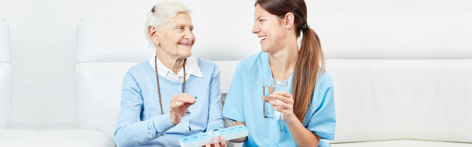 two women holding a medicine